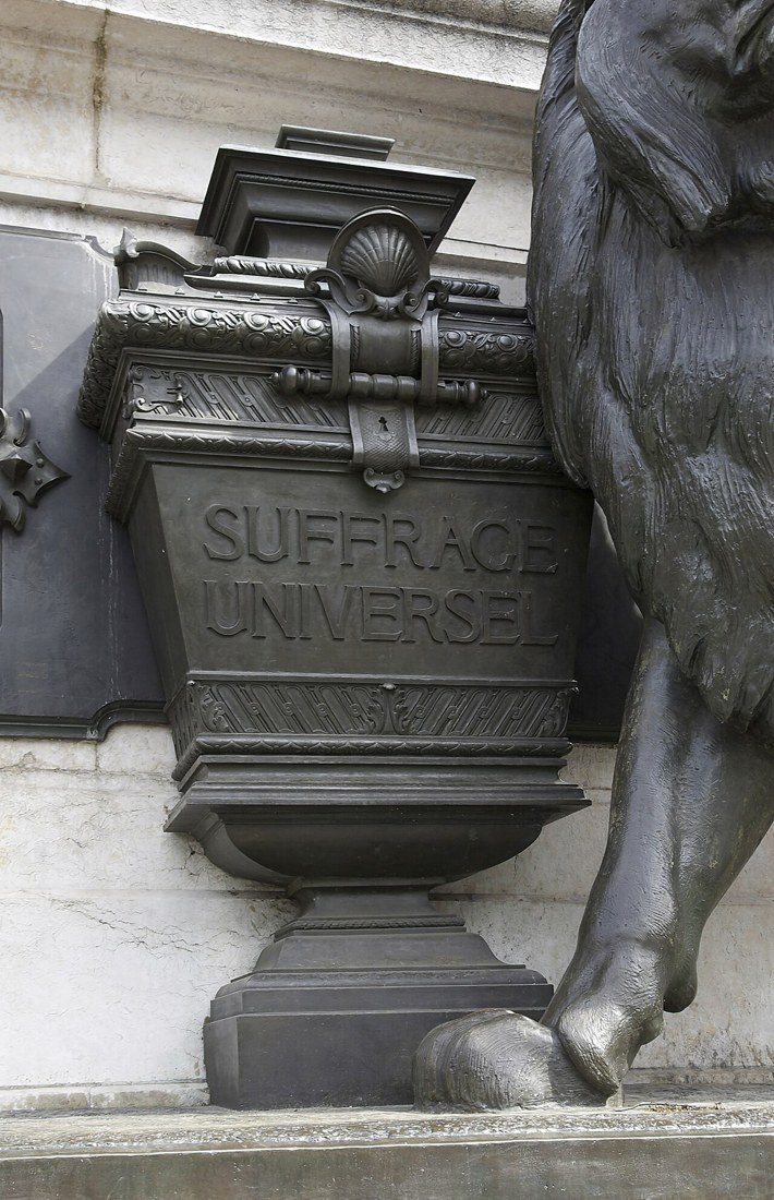 A bronze ballot-box sculpture symbolising universal suffrage in Paris. Context photograph, not a Nigerian election.