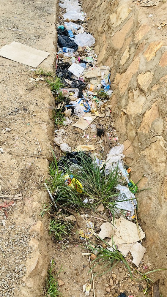 Plastic waste in a drainage channel in Butare, western Uganda. Context file photograph; not Lake Albert.