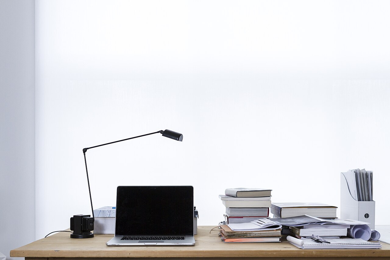 A laptop and books on a desk. File illustration of online learning, not a screenshot of the BPP portal.