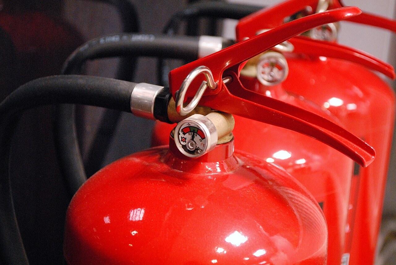 Fire extinguishers in a file photograph illustrating property-risk management. These are not identified as Epicure-insured assets or a company event.
