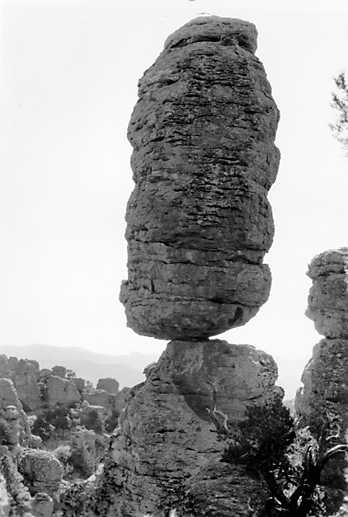 Historical ground-level photograph of a balanced rhyolite rock at Chiricahua, by George A. Grant/National Park Service. Not the 2026 satellite view.