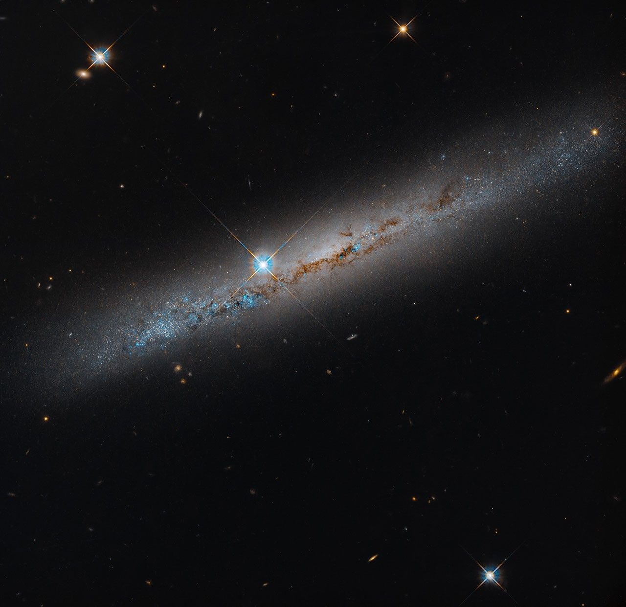 Hubble's view of NGC 1827. NASA/ESA/Michael Jones; image processing Gladys Kober (NASA/Catholic University). The spiked bright star is in the foreground.