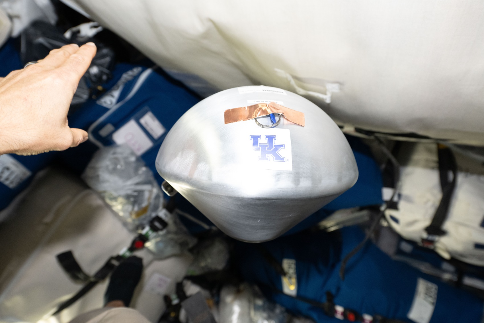 A KREPE-3 capsule inside the Cygnus cargo spacecraft in October 2026. NASA. The photograph shows experimental hardware, not a completed entry test.