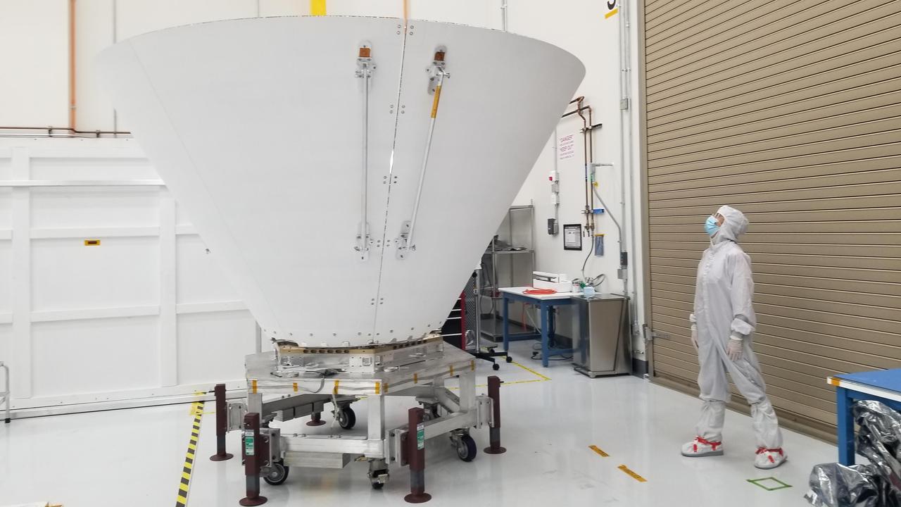 Sara Susca examines SPHEREx's outer photon shield at JPL in October 2023. NASA/JPL-Caltech. Historical mission-hardware photograph, not an image of the brown dwarfs.