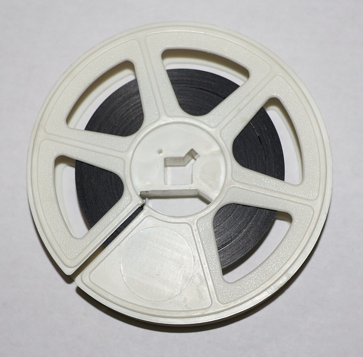 A reel of 16 mm film. Illustrative file photograph, not footage or production material from Dear Ajayi.