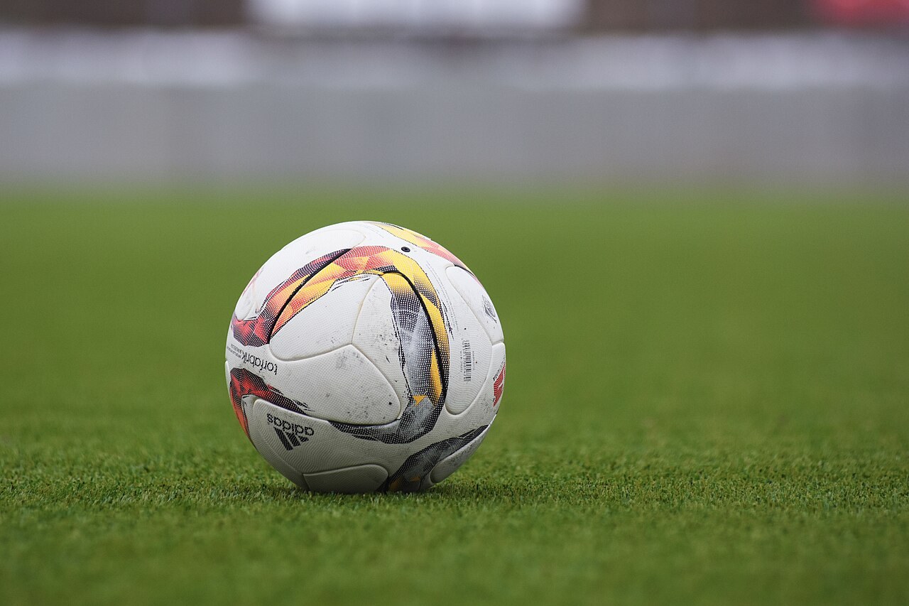 A football on grass. Context photograph; not an image from the Flamingos–Mexico match.